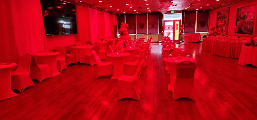 Vibrant Brundavan Banquet Hall with red lighting for themed parties and events.