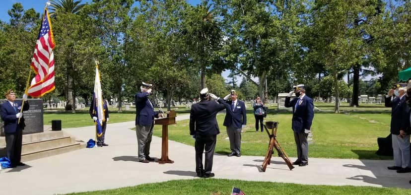 American Legion Willow Glen Post 318 memorial ceremony with participants saluting and American flag.