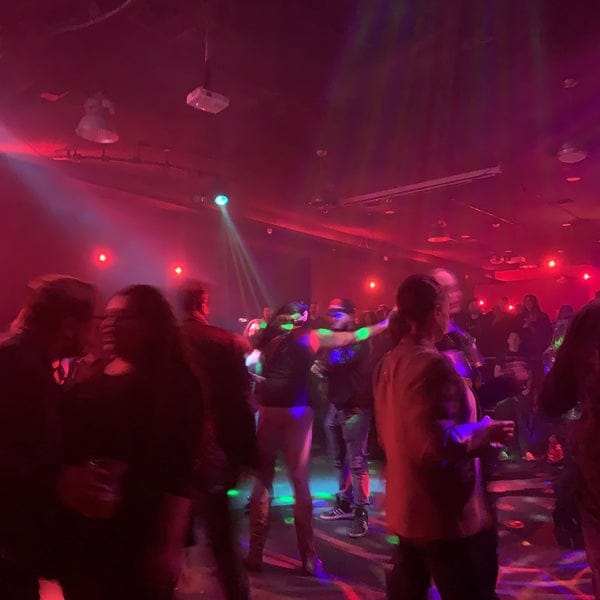 Vibrant networking event at The Ritz Nightclub with dynamic lighting and lively atmosphere.