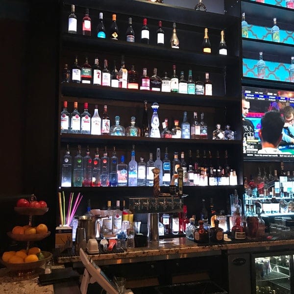 Main Lounge bar at JJ's Lounge with extensive spirits, ideal for social events.
