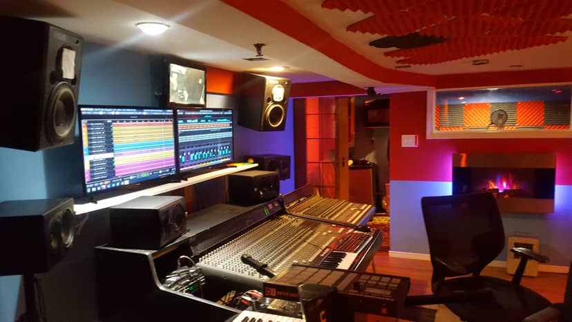 Modern recording studio with mixing console for hybrid events and virtual meetings.