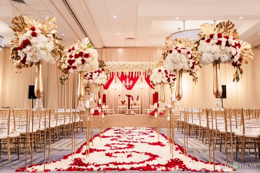 Elegant wedding venue with floral decor and romantic rose petals for ceremonies.