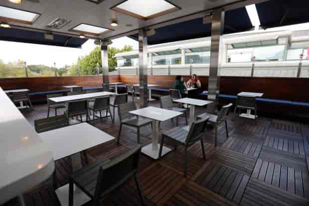 Rooftop event space at British Bankers Club with modern furniture for networking events.