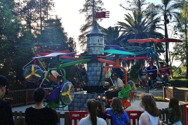 Colorful castle-themed amusement ride at Happy Hollow Park & Zoo for family events.