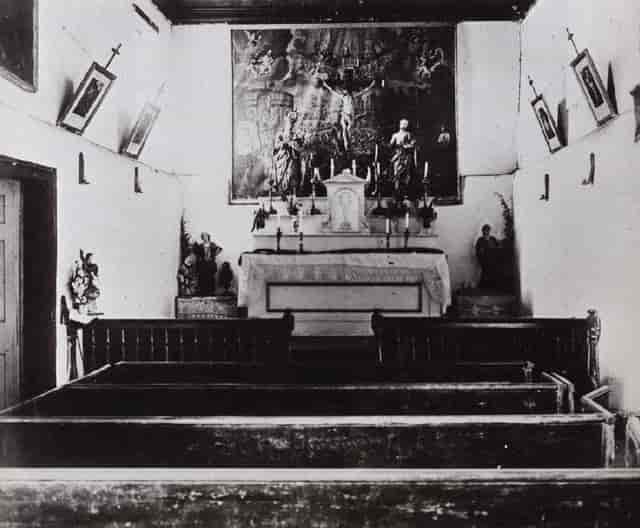 Historic Adobe Chapel with serene altar, perfect for intimate gatherings and retreats.