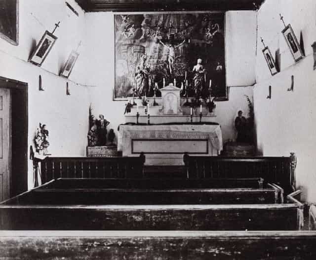 Historic Adobe Chapel with serene altar, perfect for intimate gatherings and retreats.