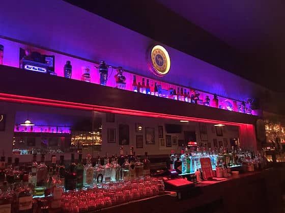 Vibrant cocktail lounge bar at The Kensington Club for networking events and social gatherings.