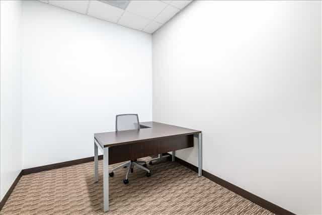 Minimalist meeting space with desk and chair at 2305 Historic Decatur Road.