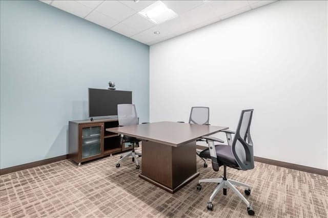 Modern minimalist meeting room with ergonomic chairs for conferences at 2305 Historic Decatur Road.