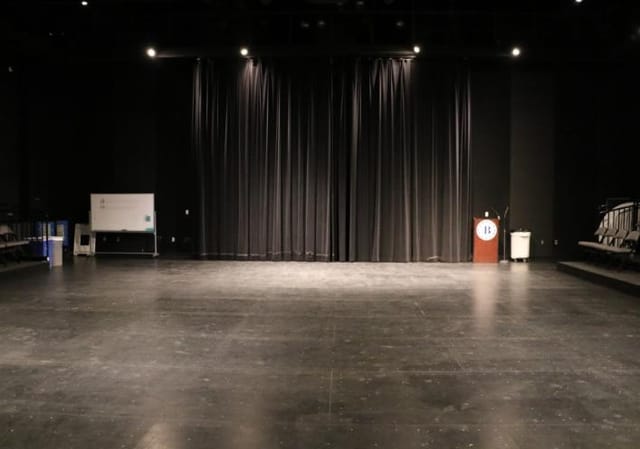 Black Box Theatre at City College: versatile event space with dark curtains for performances.