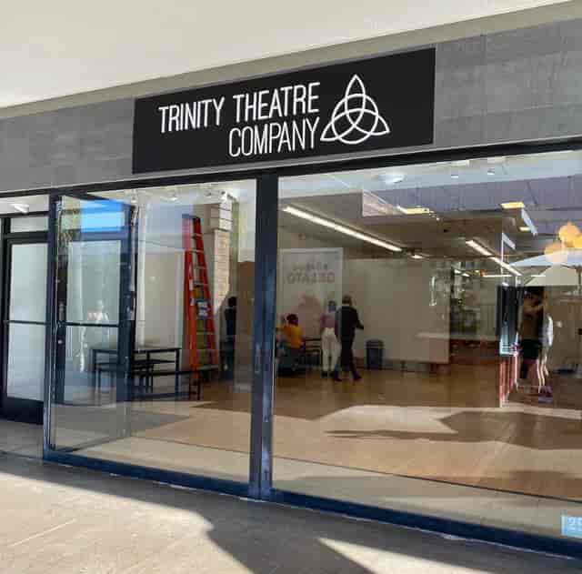 Trinity Theatre exterior with large windows, perfect for events and workshops.