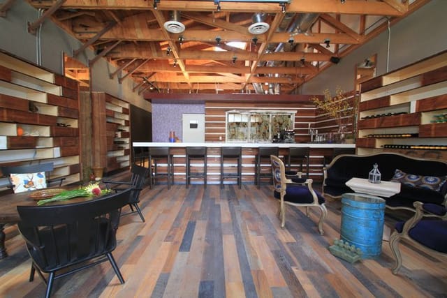 Modern event space with wooden beams for networking and social gatherings at The Rose Wine Bar.
