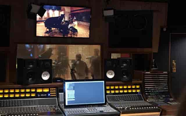 Professional recording studio at Death Beach, featuring a sleek mixing console for music events.