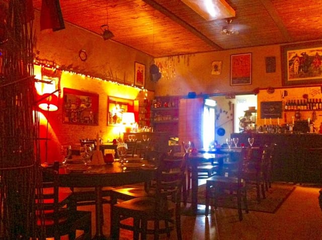 Cozy restaurant bar with warm lighting, ideal for private events and gatherings.