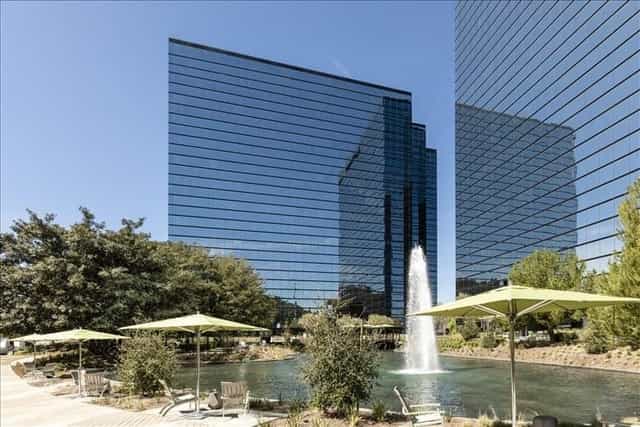 Modern coworking space with glass buildings, ideal for corporate events and networking.
