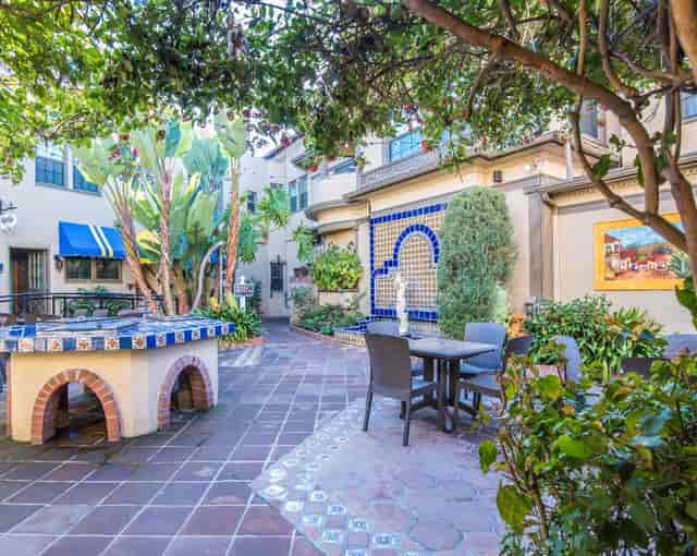 Spanish Courtyard at El Cordova Hotel, vibrant tiles, ideal for gatherings and events.
