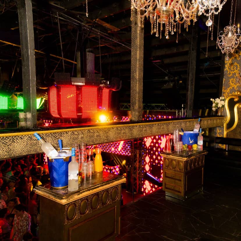 Outdoor smoking patio at Rich's San Diego, vibrant nightlife event space with stylish tables.