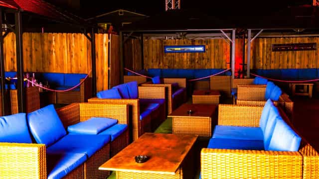 Outdoor smoking patio at Rich's San Diego with cozy seating for networking events.