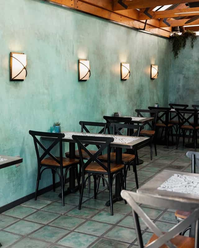 Modern Medina Kitchen patio with teal wall, ideal for events and gatherings.