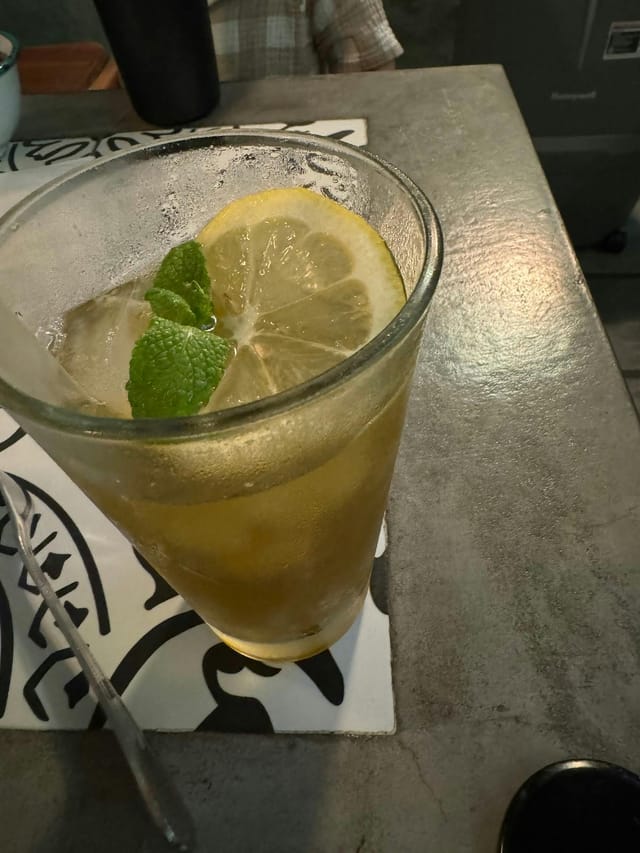 Refreshing cocktail with lemon and mint at Medina Kitchen for events and gatherings.