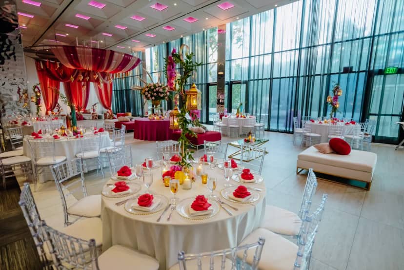 Elegant event space at Morton's The Steakhouse with round tables and floral centerpieces.