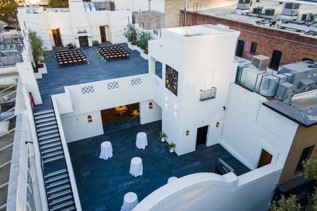 Stylish rooftop venue with elegant tables, perfect for weddings and corporate events.