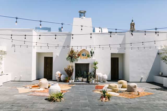 Ashley & Howard's wedding at Blanco Urban Venue with elegant outdoor seating and string lights.