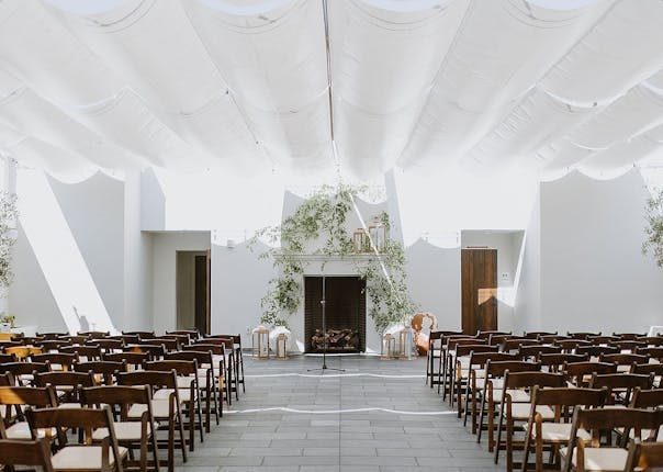 Ashley & Howard's wedding at Blanco Urban Venue with elegant seating and greenery.