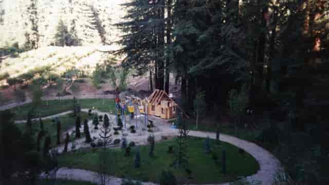 Fire pit in Nestldown, surrounded by lush forest for team-building retreats and family events.