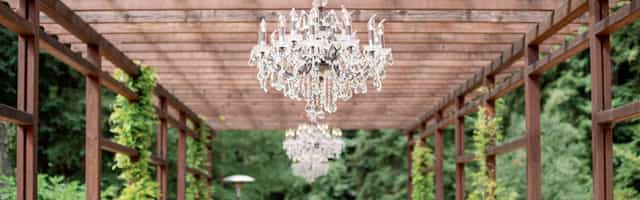 Elegant outdoor event space at Apple Knoll with chandeliers, ideal for weddings and gatherings.