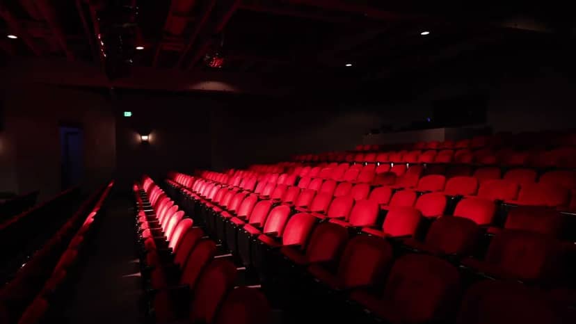 Concert seating with red chairs at Montalvo Arts Center for performances and workshops.