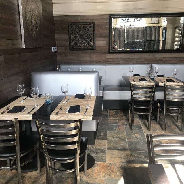 Modern dining patio at Trattoria 360, perfect for intimate gatherings and networking events.