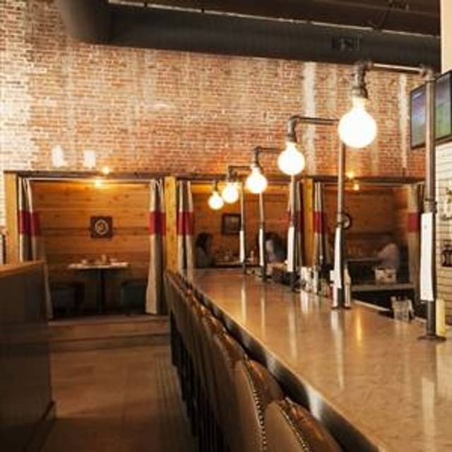 Stylish venue with exposed brick for intimate meetings and networking events.