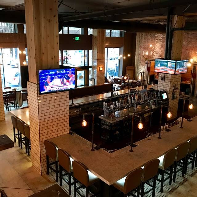Modern bar at The Farmers Union, ideal for casual meetings and networking events.