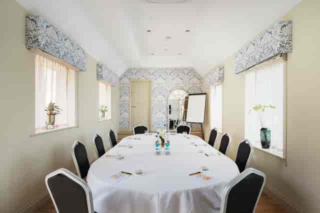 Willow Suite at Voco Lythe Hill: elegant meeting room for workshops and strategy sessions.
