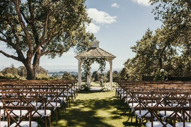 Wedding gazebo at The Hollins House, surrounded by greenery for outdoor ceremonies.