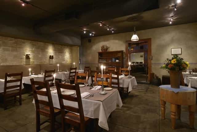 Intimate dining space in The Stone Room, perfect for private events and corporate dinners.