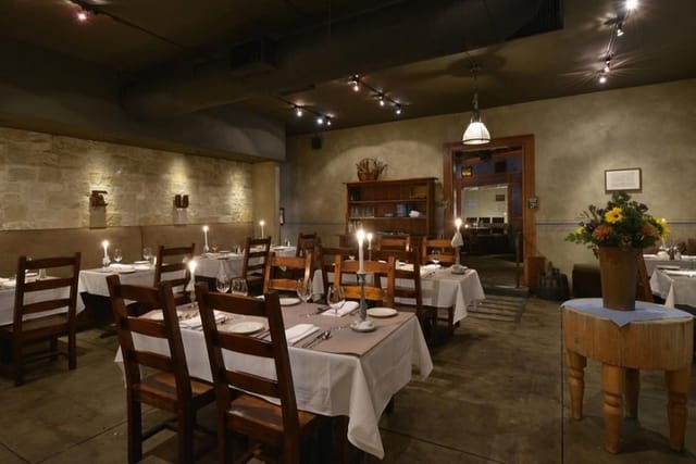 Intimate dining space in The Stone Room, perfect for private events and corporate dinners.