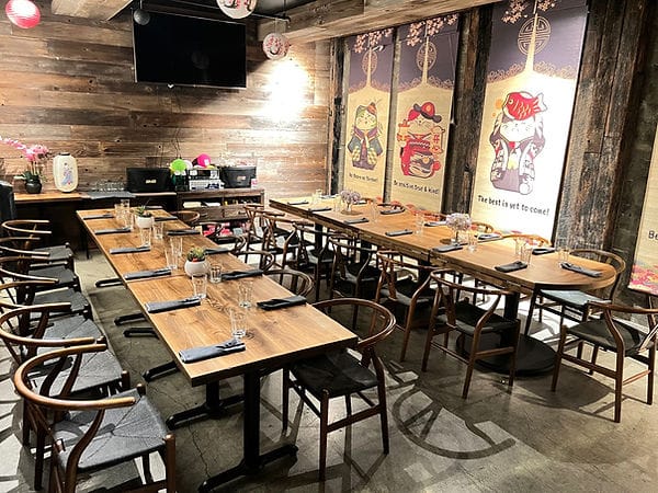 Dragon Horse Bar dining space with wooden tables, ideal for corporate events and gatherings.
