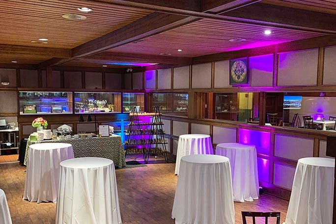 Elegant event space with high-top tables at United Irish Cultural Center, San Francisco.