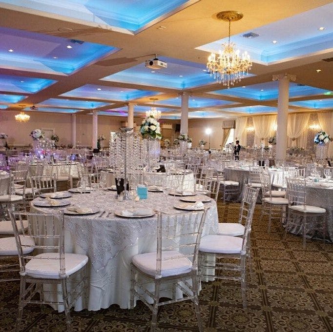 Elegant banquet hall with round tables, perfect for weddings and formal events.