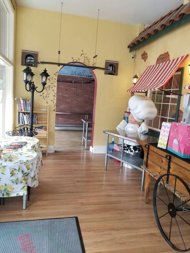 Culinary school event space with whimsical chef statue for cooking classes and parties.