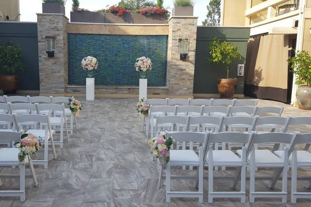 Private banquet space at Toll House Hotel with elegant floral arrangements for weddings.
