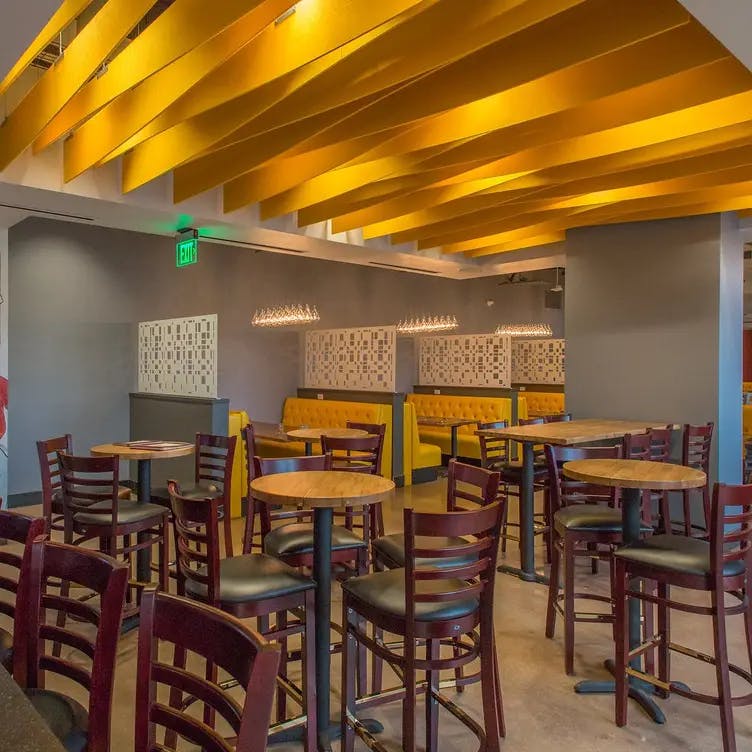 Modern banquet hall with vibrant decor, ideal for networking events and meetings.