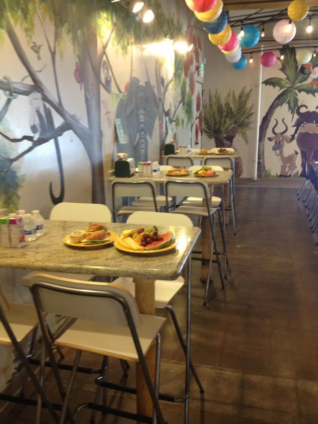 Dining room setup for event with fresh fruit, casual seating, and inviting ambiance.