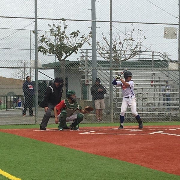 Youth baseball game at Twin Creeks Sports Complex with a well-maintained field.