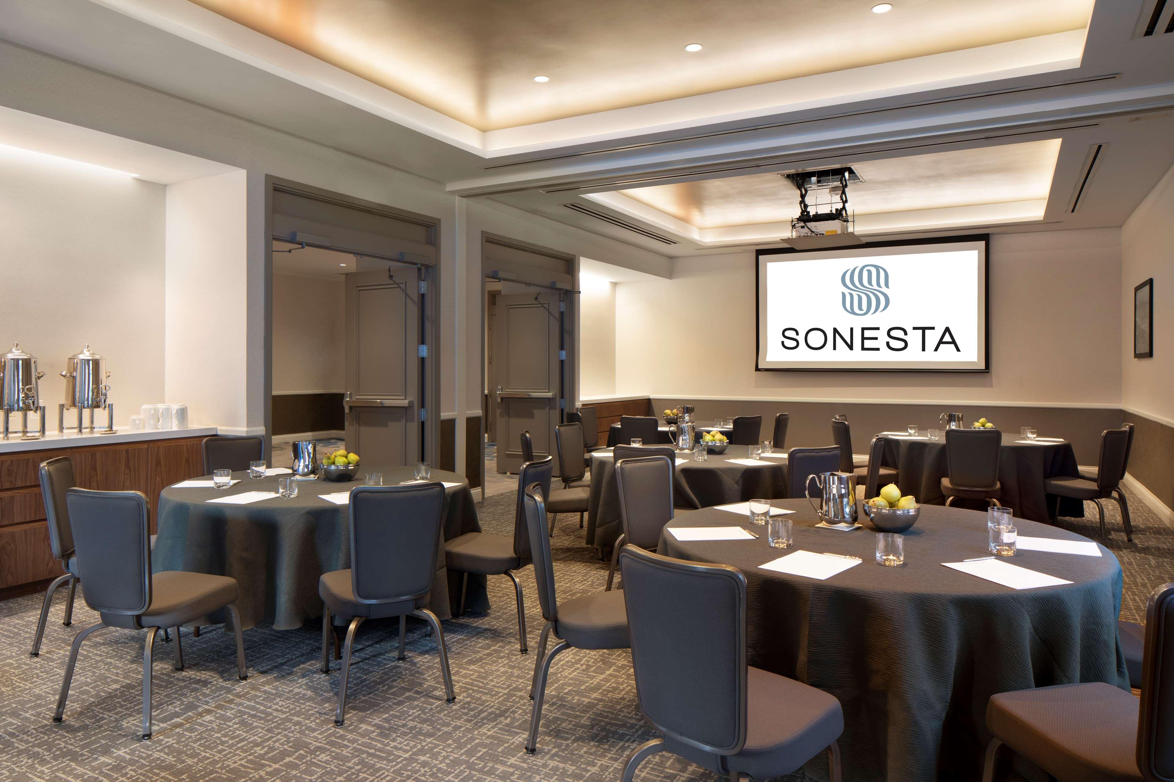 Meeting room with round tables at Embassy Suites Milpitas for professional events.