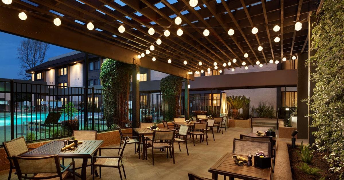 Outdoor event space with string lights at Embassy Suites Milpitas for receptions and gatherings.