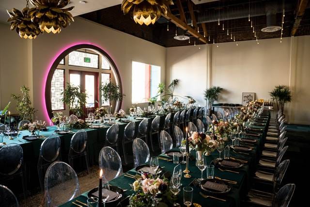 Elegant Brazilian Room with long tables, floral centerpieces for upscale weddings.