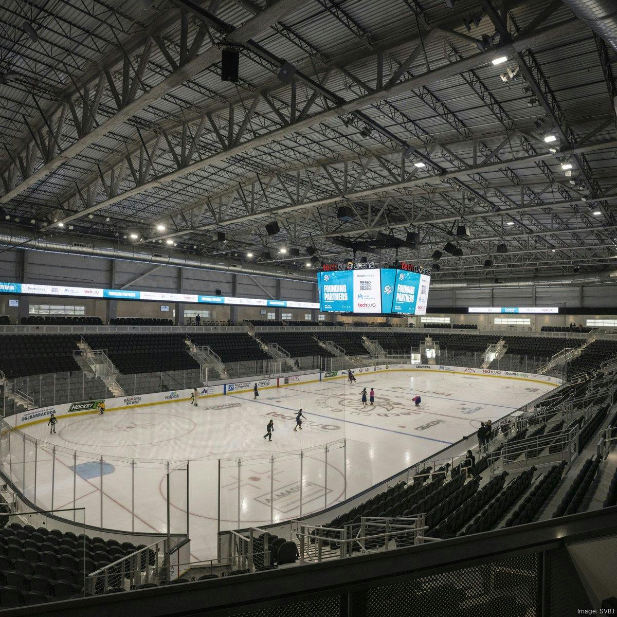 Versatile event space at Sharks Ice, featuring a digital scoreboard for corporate gatherings.